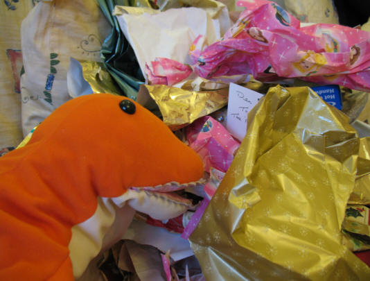 Dino checking the wrapping paper for missed presents