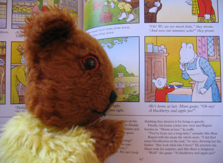 Yellow Teddy reading Rupert Bear Annual