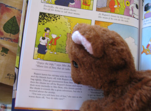 Brown Teddy reading Rupert Bear Annual