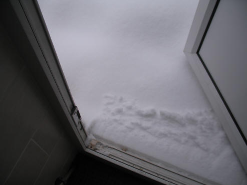 Back door step disappeared under snow