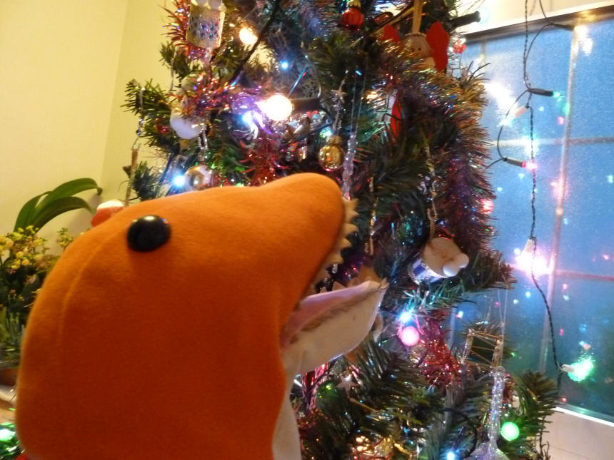 Dino checking the Christmas tree