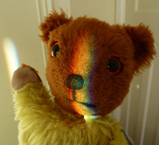 Yellow Teddy with rainbow on face