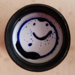 Smile face on ink bottle lid