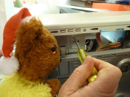 Yellow Teddy mending computer 1