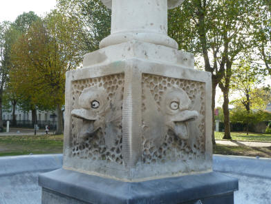 Dolphin spouts on fountain