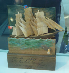 Moving wooden model of clipper ship