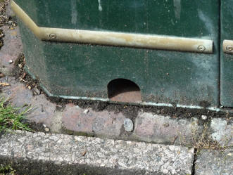 Hole in waste bin