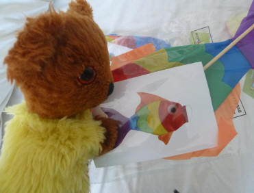Yellow Teddy opening packets of fish windsocks