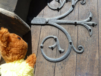 Yellow Teddy with Mission House ornamental door