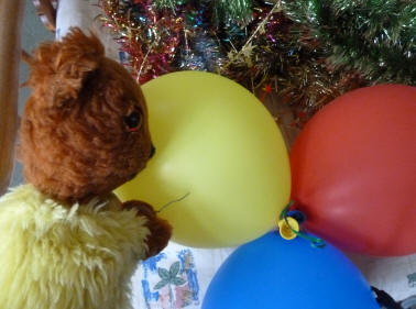 Yellow Teddy bursting balloons