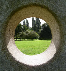 Hall Place view through stone sculpture hole