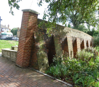 Well Hall Pleasaunce leaning brick wall with buttresses