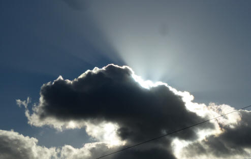Sunrays behind cloud