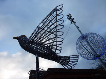 Harrow on the Hill bird decoration against sky