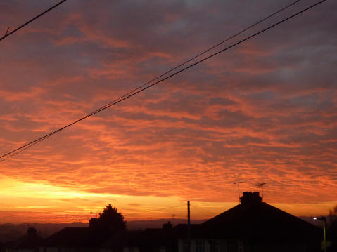 Orange dawn with fluffy sky