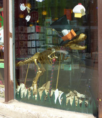 Dinosaur model in art shop window
