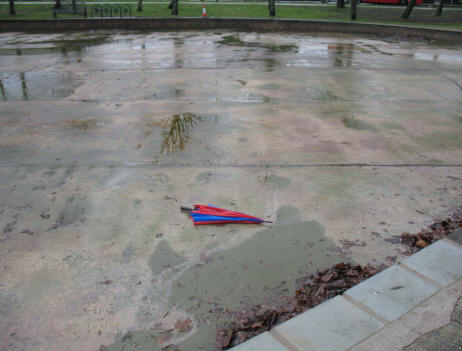 Empty boating pond with umbrella