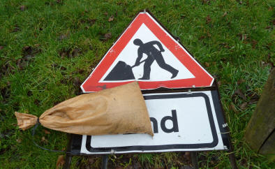 Man digging sign