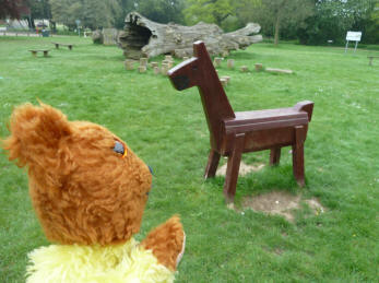 Yellow Teddy with wooden horse