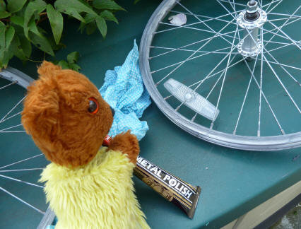 Yellow Teddy polishing bike metal work