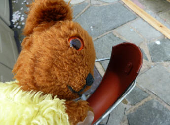 Yellow Teddy with rust painted bike mudguard