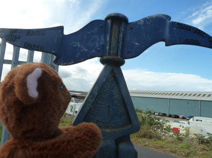 Brown Teddy with waymarket at end of Crabtree Manorway, Erith