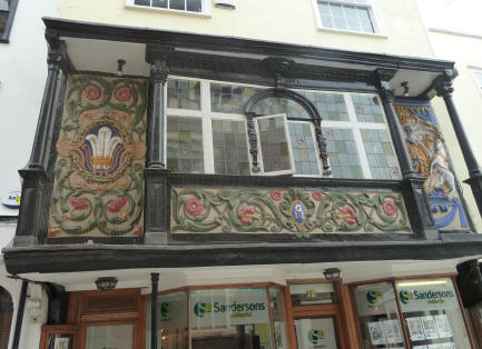 Timber-framed building with painted plaster