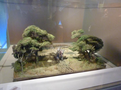 Model of prehistoric people crossing Thames marsh